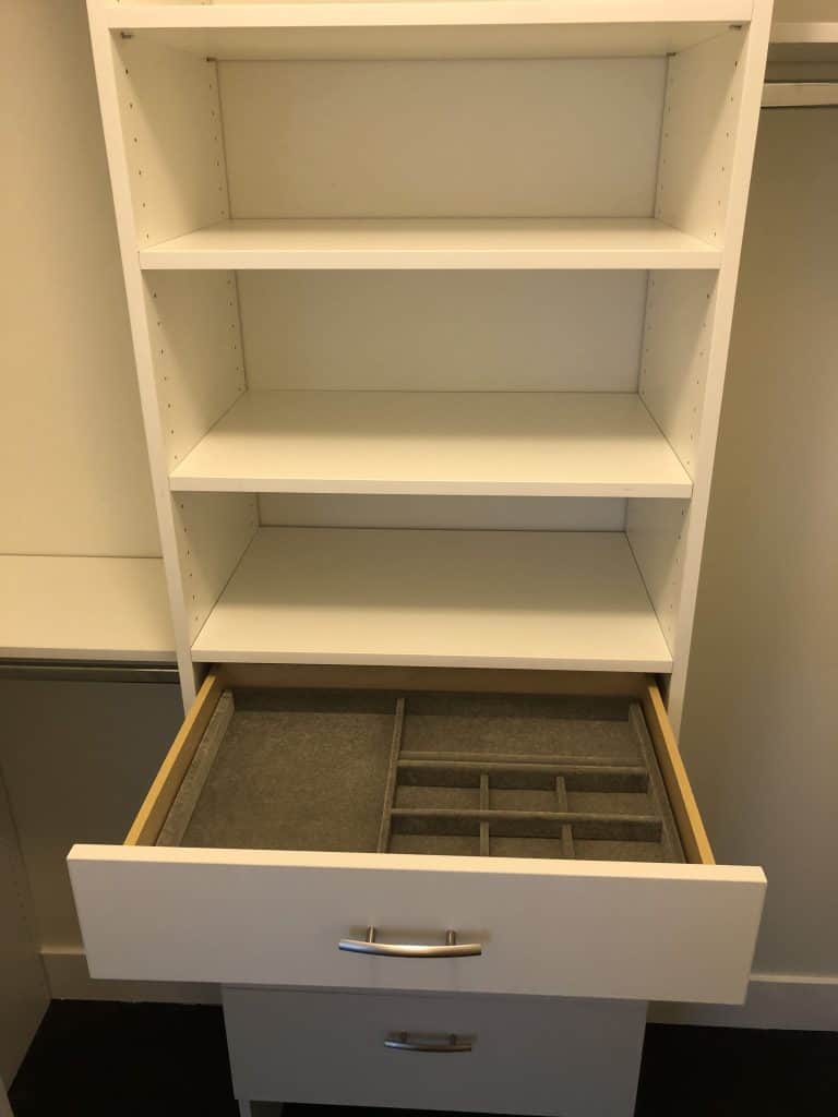 A white dresser with drawers suitable for kitchen remodeling.